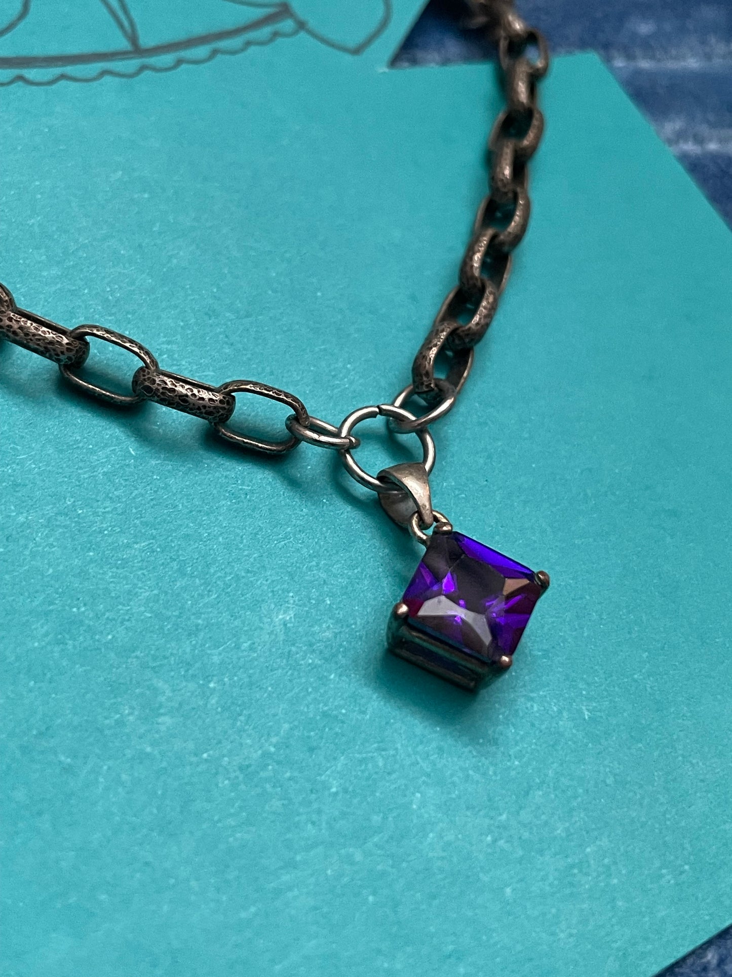 Silvertone purple dia collar clip