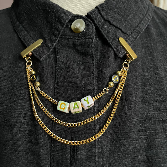 gold hearts "GAY" clip chain