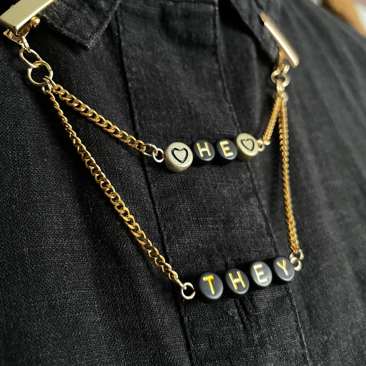 gold "HE/THEY" pronouns clip chain
