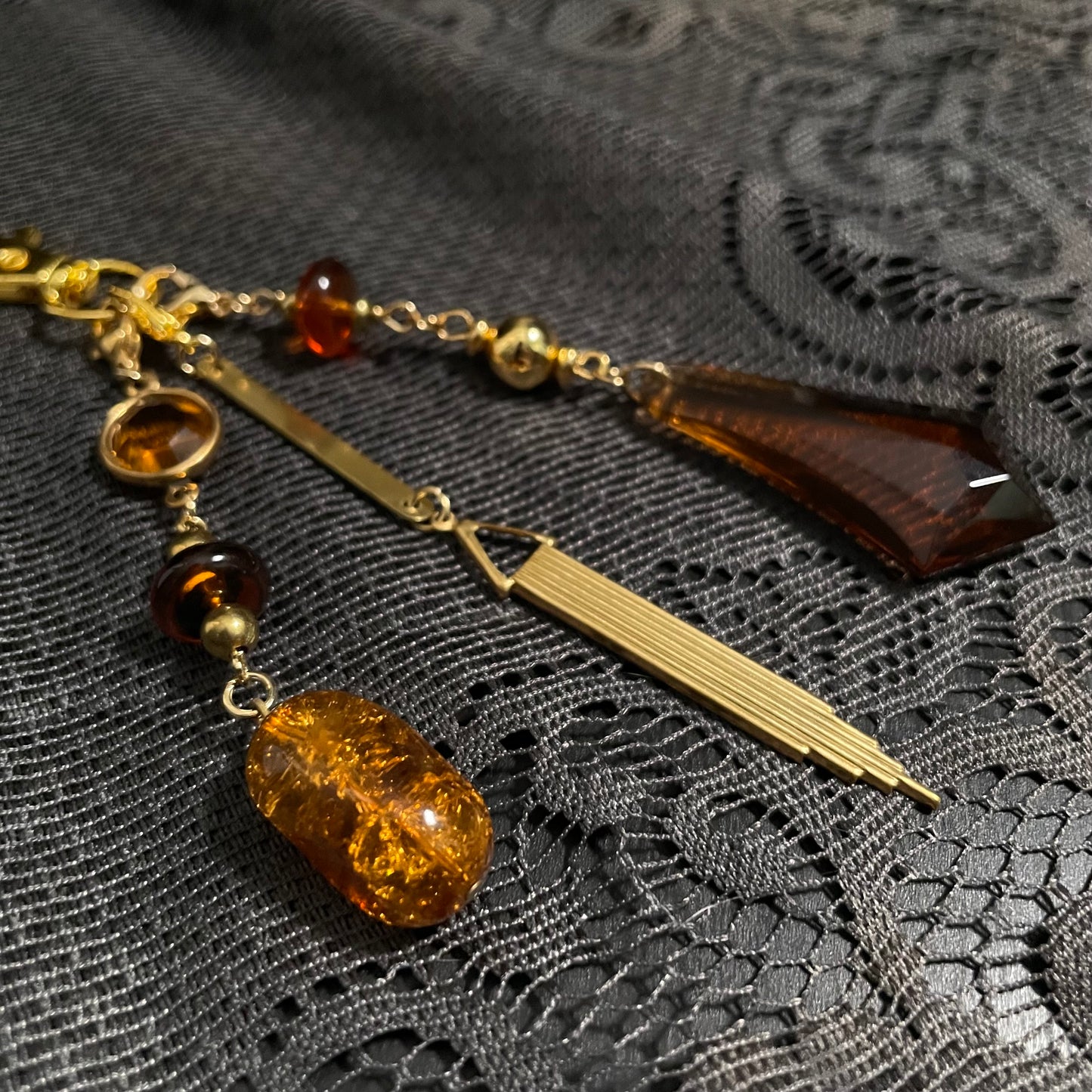 Amber & goldtone bag charm