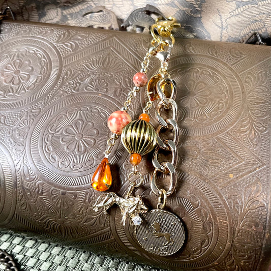 Leo goldtone bag charm