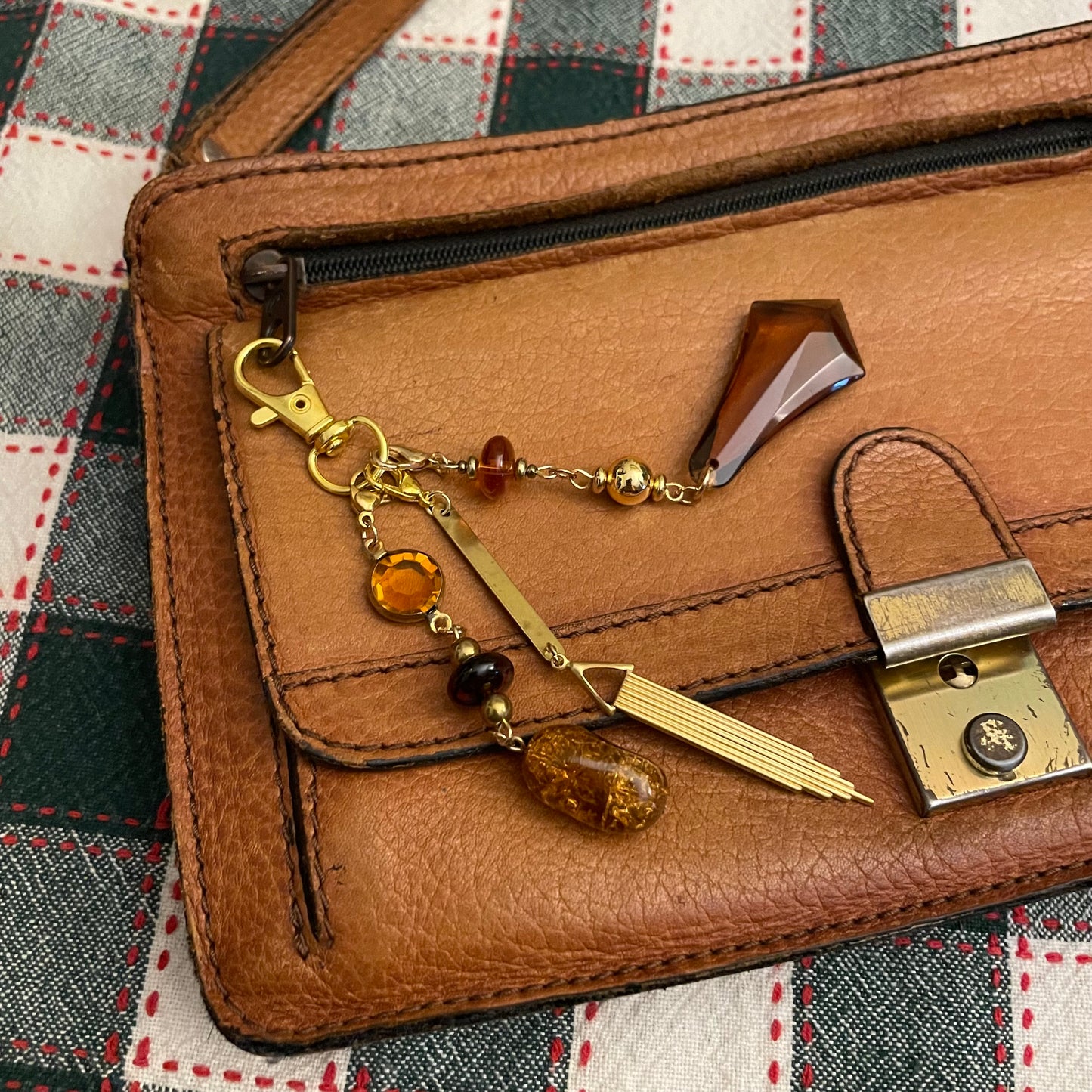 Amber & goldtone bag charm