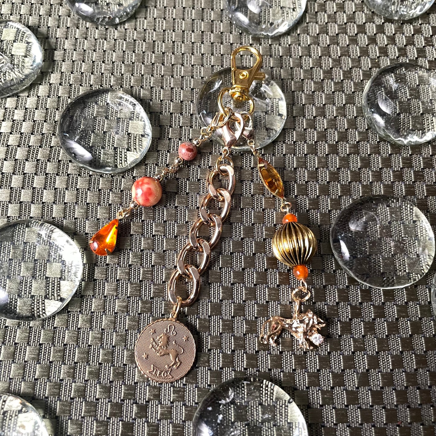 Leo goldtone bag charm