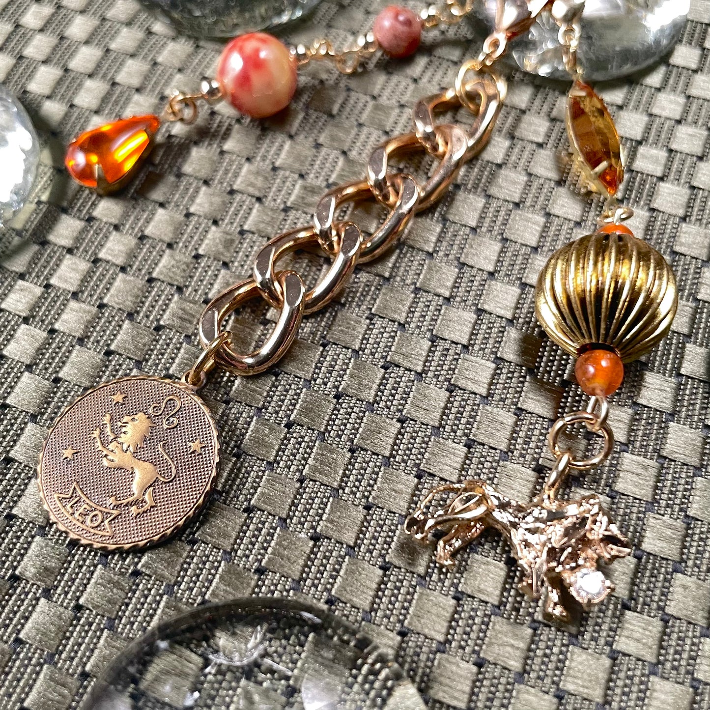 Leo goldtone bag charm