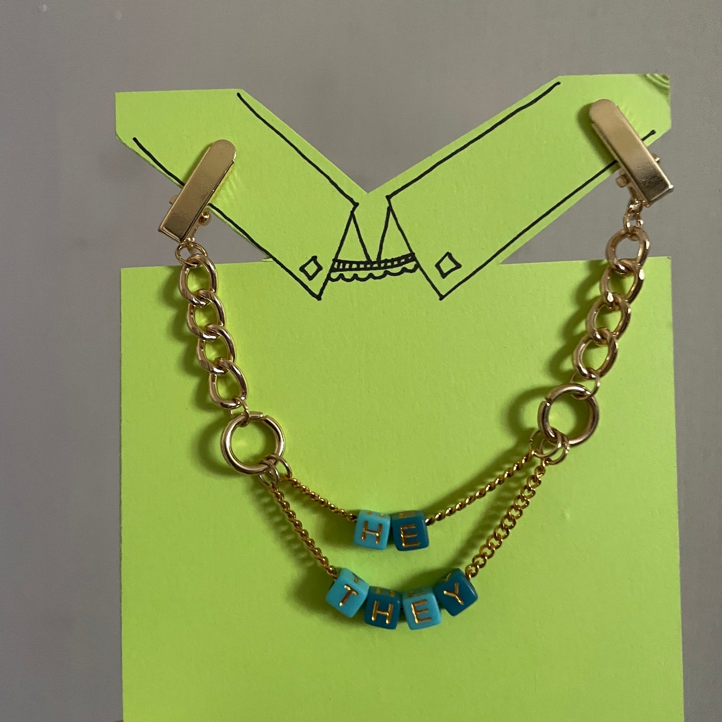 He/They Clip Chain - gold tone