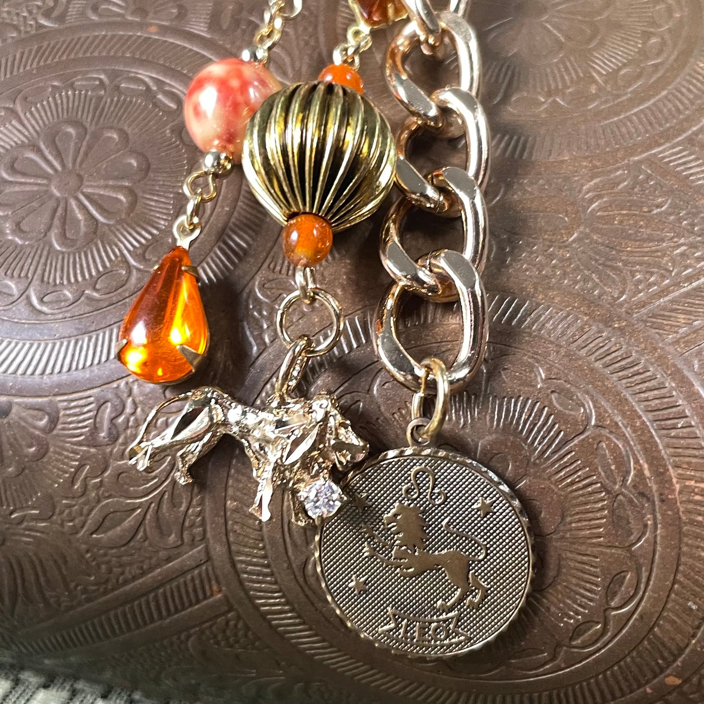 Leo goldtone bag charm
