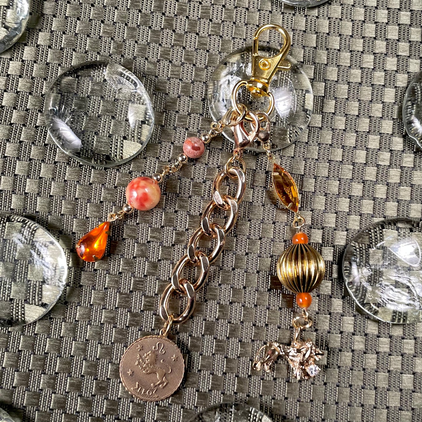 Leo goldtone bag charm